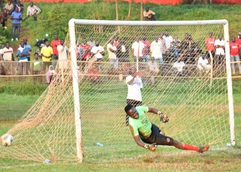 Kigulu FC's goalkeeper John Collins Wesonga tries to stretch himself to capture the ball that was already in the back of the net during penalties with Butembe FC as they were playing a semi final game during the MTN Busoga Masaza Cup tournament 2023 at Kyabazinga Stadium Bugembe in Jinja City on December 15.