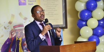 Mr. Ivan Asiimwe, UCA General Secretary and Mr. Michael Mugabi, the Managing Director at Housing Finance Bank