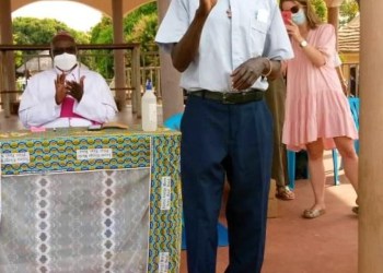 Deceased Rev Fr Denis Isa Iranya waving at the congregation at Holy Cross Indriani Pilgrim Centre Catholic Mission.