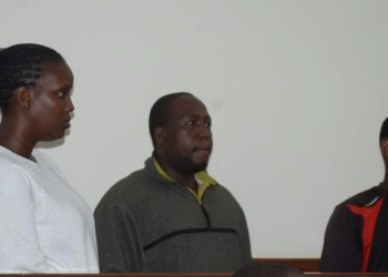 Patricia Kakwanza(L) and two other suspects at the dock at the magistrate's court in Nakawa recently in connection to the murder of businessman Katanga.