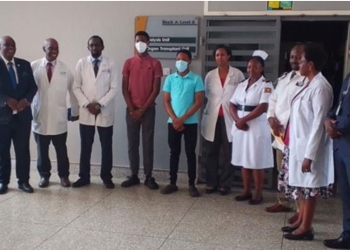 The donor and the recipient wearing red and green tshirts standing with Nephrologists at Mulago Hospital. Nephrologists in the picture incluede Dr Steven Assimwe and Dr. Simon Peter Eyoku.