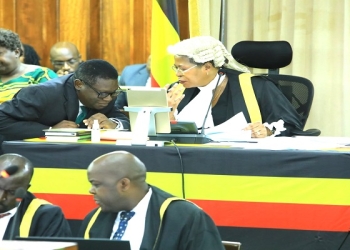 The Minister of Justice and Constitutional Affairs, Hon. Norbert Mao, consulting with Speaker Anita Among during the Tuesday plenary