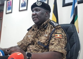 Senior Commissioner of Police Fred Enanga addressing reporters