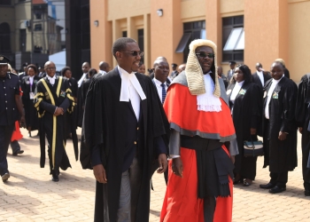 Attorney General Kiryowa Kiwanuka and Chief Justice at High court grounds on Friday. (Photos by Judiciary)