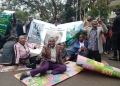 Some of the Farmers seated in the middle of Apollo Kaggwa Close leading to Ministry of Finance