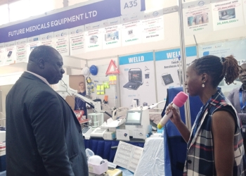 Prof John Charles Kirya from the Allied Health Professional Council inspecting stalls.