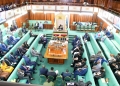 Uganda's Parliament approved UGX 5.6 trillion in new loans amid soaring public debt and concerns over oversight. Experts question the nation's borrowing strategy as undisbursed funds accrue interest.