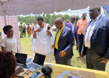Minister of Local Government Hon Raphael Magezi (CENTER) tours Letshego stall during Women’s Day celebrations hosted by Hon Annet Katusiime Woman MP (RIGHT) Bushenyi at St Kaggwa Primary School as Letshego unveiled its Micro Supa Loan tailored to Women and Youth.
