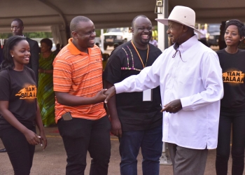 Dr. Balaam Barugahare with President Yoweri Kaguta Museveni at one of the events (Courtesy photo)