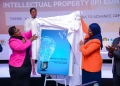 Mercy Kainabwiso from URSB and Dr. Aminah Zawedde launching the