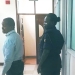 Businessman Musa Ssenteza (center) being escorted by prison authorities to the Kampala Central Prison on May 13, 2024, after being remanded by the Anti-Corruption Court for forgery and tax evasion charges (PHOTO/URA)