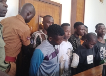 The seven acussed persons in court on Friday.