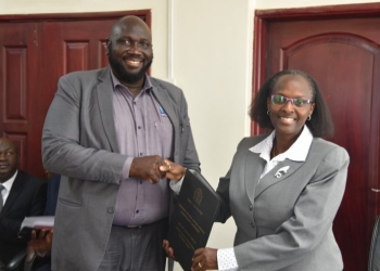 Mr. Othembi (Left) handing over office to Dr. Tibihikirra  on Tuesday. (Courtesy photo)