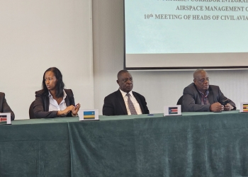 Here is a photo caption: "Kigali, Rwanda - Officials from Northern Corridor Partner States gather for a historic signing ceremony at Hotel Mille Collines. The signing of the MoU on Sharing and Fusion of Air Traffic Control Surveillance data and the Operationalization of the MoU on Aircraft Accident and Incident Investigation marks a significant milestone in harmonizing airspace management and reducing air travel costs in the region. Pictured (L-R) are Dr. Fred K. Bamwesigye (Uganda), Amb. Richard Kabonero (Uganda), and representatives from Rwanda and other Partner States, solidifying their commitment to enhanced cooperation in aviation."