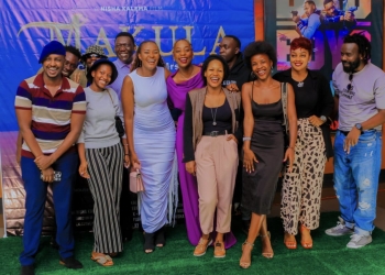 Nisha Kalema(white dress) with some of the cast team members and other people that turned up for the screening event. (Courtesy photo)
