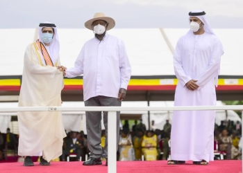President Yoweri Museveni (center) flanked by Sheikh Mohammed Bin Maktoum Bin Juma Al Maktoum (left) and Ambassador Abdalla Al Shamsi (right) at the Heroes Day celebration in Kampala, Uganda. The President conferred the highest medal on Sheikh Mohammed Bin Maktoum Bin Juma Al Maktoum in recognition of his contributions to Uganda's development. The occasion honored the sacrifices of national heroes and further strengthened the diplomatic ties between Uganda and the United Arab Emirates (PHOTO/Courtesy).
