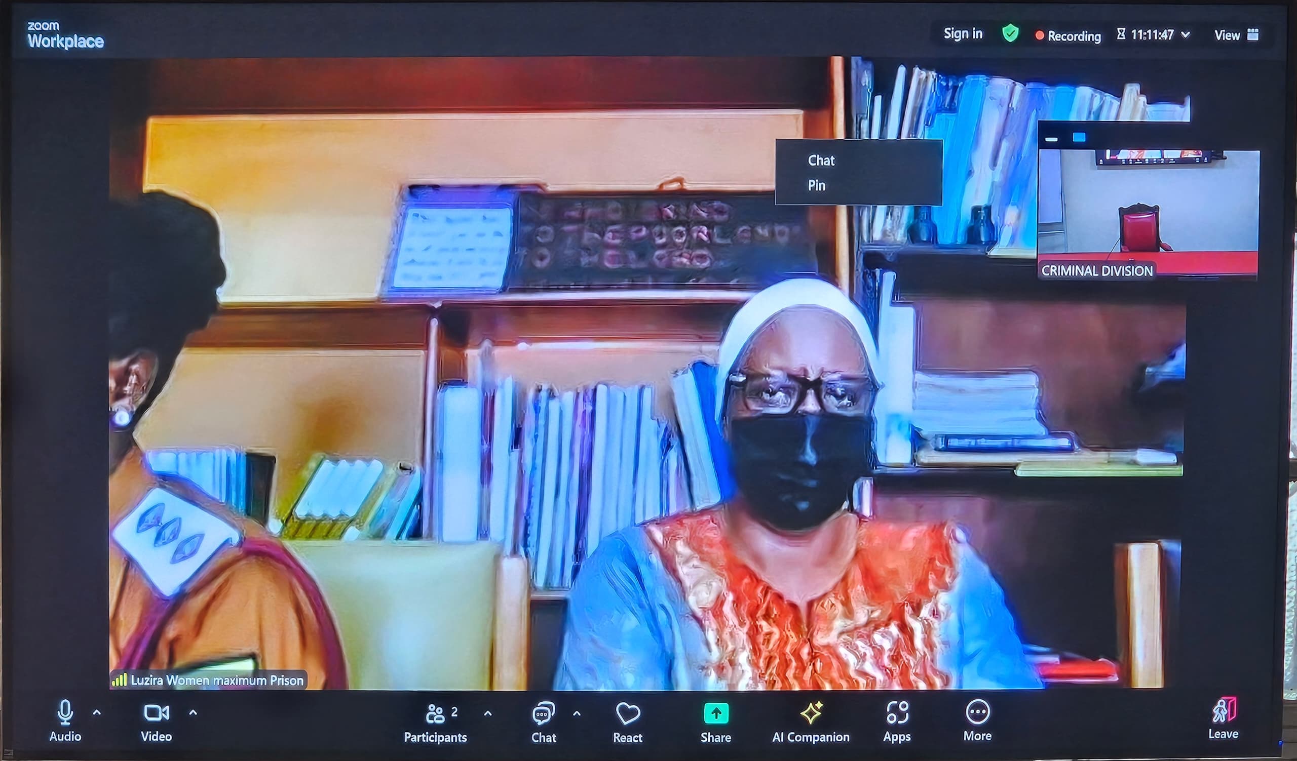 Molly Katanga, on trial over the death of her husband Henry Katanga, appears in court via video link