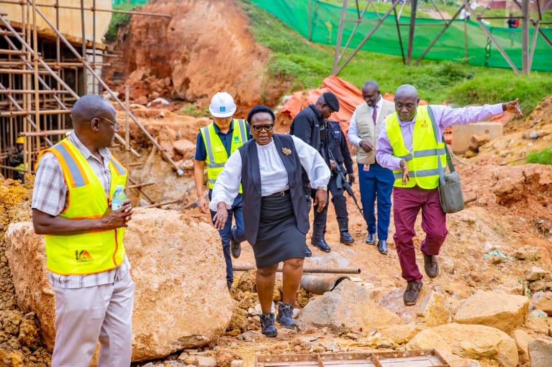 KCCA Executive Director Dorothy Kisaka inspects ongoing road rehabilitation works on Kayemba Road, a critical link in Kampala's transportation network. She is seen here assessing the progress and engaging with contractors on site, reaffirming her commitment to delivering high-quality infrastructure projects that transform the city's landscape.