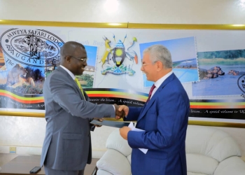 Mourad Amokrane, Ambassador-Designate of Algeria to Uganda, presents his Letters of Credence to John Mulimba, Minister of State for Foreign Affairs, at a ceremony held at the Ministry of Foreign Affairs in Kampala, Uganda. The presentation of credentials marks the official beginning of Amokrane's tenure in Uganda and strengthens the diplomatic ties between the two nations.