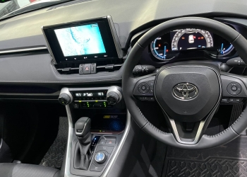 The all-new Toyota RAV4 Hybrid Electric's interior features a multimedia touch screen, leather seats, and advanced ventilation systems, providing a comfortable and connected driving experience