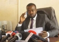 Former Resident City Commissioner (RCC) Burora Herbert Anderson addresses reporters during a press conference in Kampala, Uganda, calling on President Yoweri Museveni to take action against Speaker of Parliament Anita Annet Among and other officials implicated in corruption. Anderson, recently released from 22 days in detention, emphasized the need for accountability and transparency in government, and vowed to continue the fight against corruption.