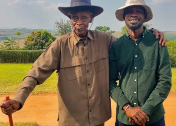 Mzee Ernest Nvunganyi (left) and National Unity Platform leader Robert Kyagulanyi Ssentamu, aka Bobi Wine (right), in a photo taken on an unspecified date. Mzee Nvunganyi, Bobi Wine's grandfather-in-law, passed away on August 19, 2024. (PHOTO/Courtesy)