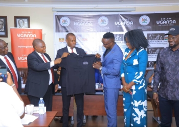 The Minister of State for Tourism together with the High Commissioner of Kenya to Uganda and the Consulate General, Mombasa branding Kenya,s top tourism influencers with Explore Uganda Tourism brand at MOFA Hdqtrs _Kampala.