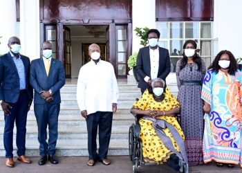 President Museveni poses for a photo with  family members of the late Bazilio Olara Okello led by the widow Mrs Bazilio Olara Ataro (in wheel chair) after a meeting at State House Entebbe on Wednesday. PPU