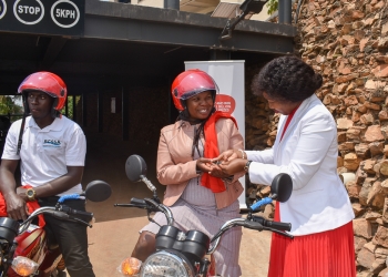 Head of Retail at Airtel Uganda, Caroline Asio(R) handing over a motorbike to one of the winners in the ongoing nationwide Airtel Vroomula Amajja campaign, aimed at promoting cashless transactions and enhancing digital financial services. The campaign was launched recently, to reward Ugandans using Airtel Money with prizes, including; a grand prize of a new Toyota RAV4 Hybrid sports utility vehicle, motorbikes, and e-money.