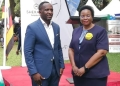 Edwin Musiime, Chairman of Olim Group, and Lands and Housing Minister Persis Namuganza (PHOTO/UG Standard)