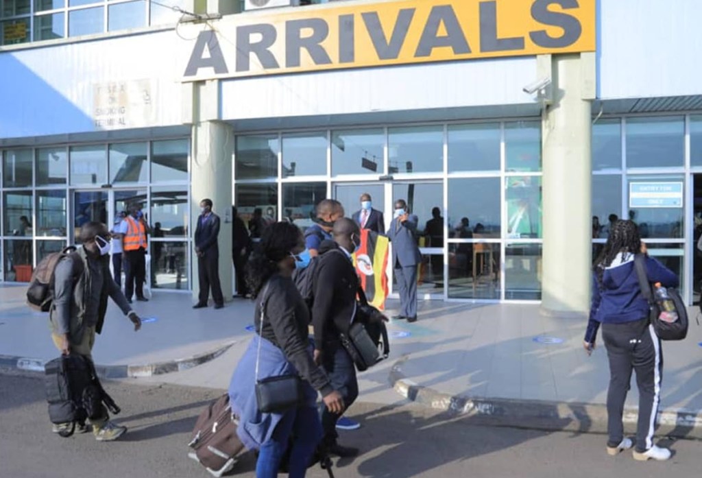 Travelers arrive at Entebbe International Airport, Uganda, where new baggage clearance procedures aim to streamline customs and boost trade.