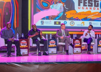 Hon. Sidronius Opolot, the state minister for mineral development (2nd left) addressing the youth during the conference