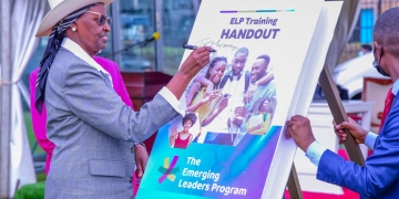 Uganda's Education Minister, Janet Kataaha Museveni, leaves her mark on a symbolic book during the historic launch of the Emerging Leaders Program at Makerere University on Friday, September 27, 2024.