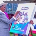 Uganda's Education Minister, Janet Kataaha Museveni, leaves her mark on a symbolic book during the historic launch of the Emerging Leaders Program at Makerere University on Friday, September 27, 2024.