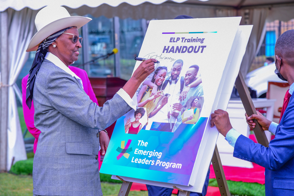 Uganda's Education Minister, Janet Kataaha Museveni, leaves her mark on a symbolic book during the historic launch of the Emerging Leaders Program at Makerere University on Friday, September 27, 2024.