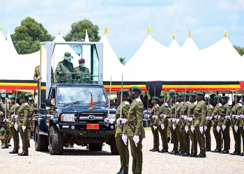 President Museveni watches a military parade by cadet officers during their passout at the Uganda Military Academy in Kabamba on Tuesday. PPU Photokabamba