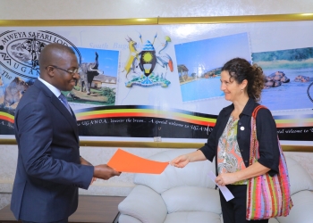 Uganda's Minister of State for Foreign Affairs, John Mulimba, receives Letters of Credence from Maria Gema, the new Médecins Sans Frontières (MSF) country representative, during a ceremony at the Ministry of Foreign Affairs in Kampala