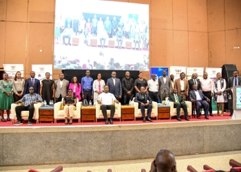 Balaam Barugahara in a group photo with organisers and discussion panel at the opening of the Expo on October 31st, 2024 at Yusuf Lule Auditorium