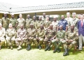 "Defence Attachés accredited to Uganda gather for a group photo during their visit to the UPDF Mountain Division headquarters in Fort Portal City, expressing solidarity and support for regional security efforts."