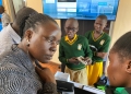 Students of Spire Primary School demonstrating the use of the internet and sound and visual gadgets that support students with visual and hearing impairments in classroom activities.
