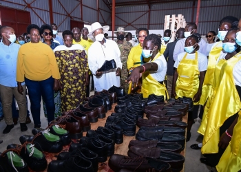 President Museveni inspects some of the leather products made by the youth at the Teso industrial hub in Soroti City