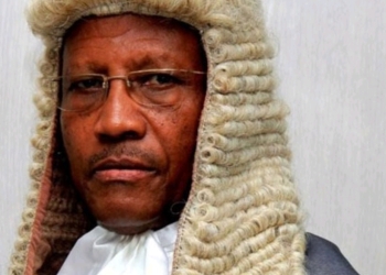 Deputy Chief Justice Richard Buteera dons a formal wig, a traditional attire for high-ranking judicial officials, as he presides over court proceedings