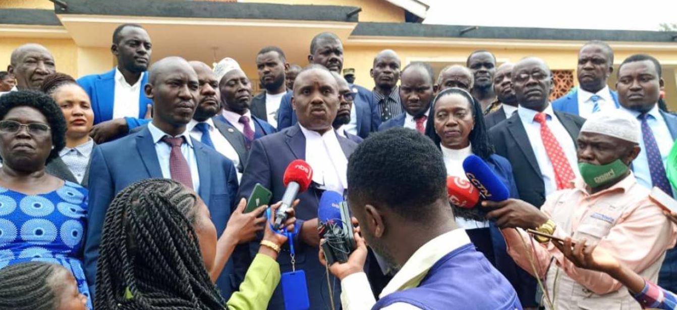 Dr. Kizza Besigye's legal team addresses journalists after a court session where Besigye and his co-accused, Haji Obeid Lutale, were further remanded to Luzira Prison until December 10, 2024 