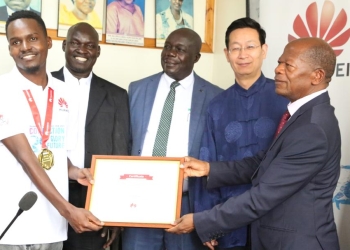 Hon.John Chrysestom Muyingo with Huawei officials and the winners