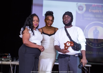 Male Deogratious aka Tinta (right) and colleagues after winning the award.