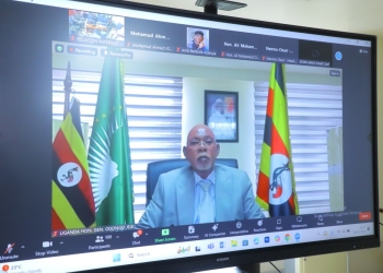 Uganda's Minister for Foreign Affairs, Gen. Jeje Odongo, addresses a ministerial meeting on the situation in Somalia and post-ATMIS security arrangements via video link, emphasizing the need for sustainable funding for the African Union Support and Stabilisation Mission in Somalia (AUSSOM)
