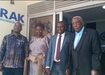 L-R , Eng Rogers Kamuhanda his parents and Eng Isabirye Gerald Isabirye (2nd right) at the new RAK offices on Saturday.