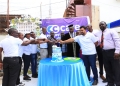 His Royal Highness Omukuka III Jude Mike Mudoma, Azhar Sundhoo, CEO of C-Care Uganda, and other dignitaries cut a cake to mark the official launch of C-Care's state-of-the-art facility in Mbale, Uganda.