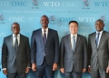 Uganda's Secretary to the Treasury, Ramathan Ggoobi, flanked by his delegation, poses with WTO Deputy Director-General Zhang Xiangchen in Geneva, Switzerland, after discussing Uganda's ambitious 10-fold growth strategy aimed at transforming the country's economy.