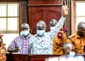 Dr. Kizza Besigye and Hajj Obeid Lutale during court proceedings.